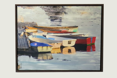 Colorful dinghy dock of Red and blue dinghies in  golden afternoon light. Framed in Solid brown hand wood  frame.